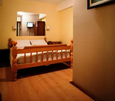 a bedroom with a bed and a large mirror at B&B Stadion in Belgrade