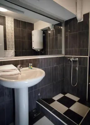 a bathroom with a sink and a shower at B&B Stadion in Belgrade