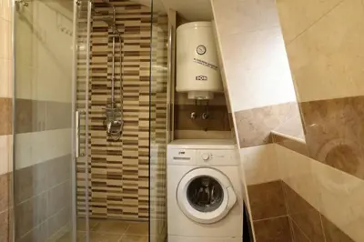 a small bathroom with a washing machine in it at Belgrade Center Apartment Nusiceva in Belgrade