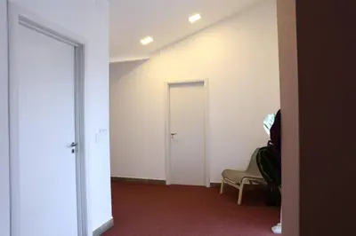 an empty room with a door and a chair at Belgrade Center Apartment Nusiceva in Belgrade