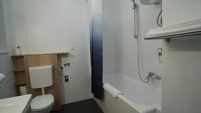 a bathroom with a toilet and a sink and a shower at Yes Apartment, Belgrade Center in Belgrade