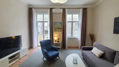 a living room with a couch and a tv at Yes Apartment, Belgrade Center in Belgrade