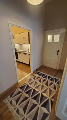 a room with a hallway with a door and a rug at Yes Apartment, Belgrade Center in Belgrade