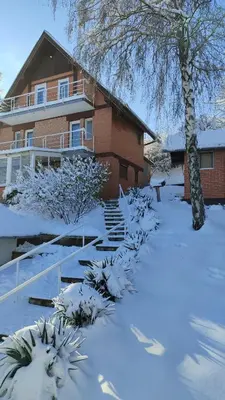 a house with snow on the ground in front of it at House 33 in Stari Slankamen