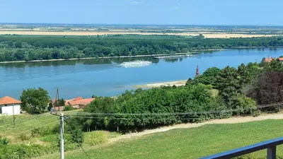 a view of a river with a boat in it at House 33 in Stari Slankamen