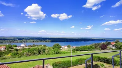 a view of a lake from the balcony of a house at House 33 in Stari Slankamen