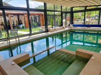 a large swimming pool with a large group of windows at Vila MP Banstol 4*- Brdež do, Fruška gora in Inđija