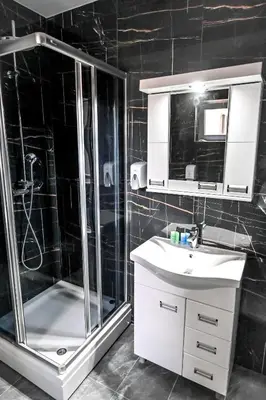 a bathroom with a shower and a sink and a shower at Respect034 in Arandjelovac