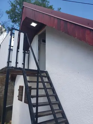 a staircase leading up to a building with a door at Vila Slankamenka in Stari Slankamen