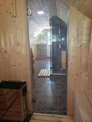 a bathroom with a shower with a glass door at Vila Slankamenka in Stari Slankamen