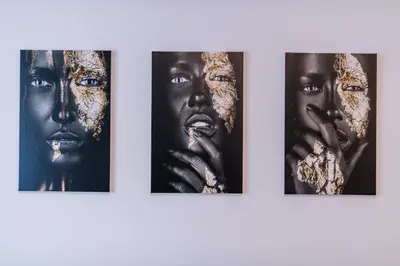 a group of four black and white photographs on a wall at Marshal Doctor in Belgrade