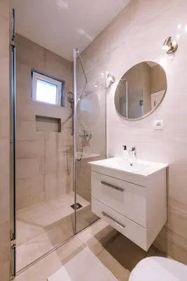 a bathroom with a shower and a sink and a mirror at Marshal Doctor in Belgrade