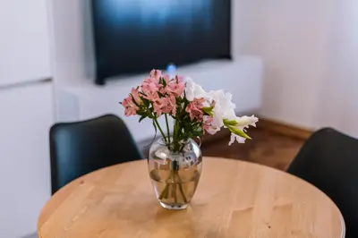 a vase of flowers sitting on a table at Marshal Doctor in Belgrade
