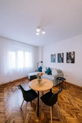 a living room with a table and a couch at Marshal Doctor in Belgrade