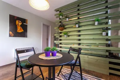 a dining room with a table and two chairs at Seosko Domaćinstvo Pustolov in Stari Banovci