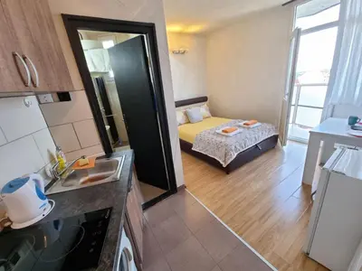 a small room with a bed and a bathroom at City View in Belgrade