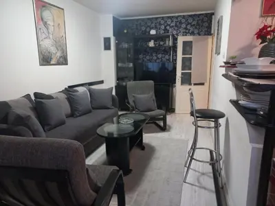 a living room with a couch and a table at Donji Grad in Belgrade
