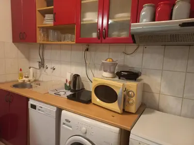 a microwave sitting on a counter in a kitchen at Donji Grad in Belgrade
