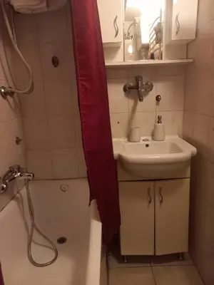 a bathroom with a sink and a toilet and a shower at Donji Grad in Belgrade
