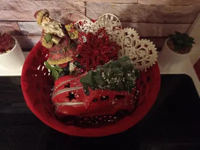a red plate with a red car on a table at Apartman EN in Dušanovac (historical)