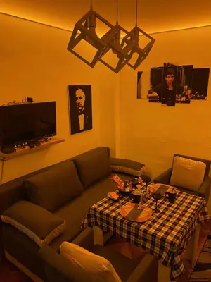a living room with a couch and a table at Apartman EN in Dušanovac (historical)