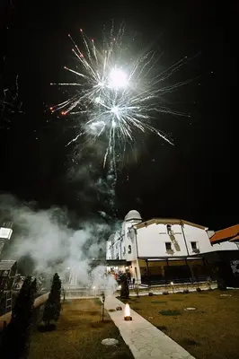 a fireworks display in the sky over a building at Hotel GardeNN in Belgrade