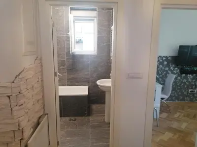 a bathroom with a toilet and a sink at Natasa in Zvezdara