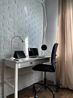 a white desk with two laptops on top of it at Allure of Belgrade (80m2-861ft2) in Belgrade