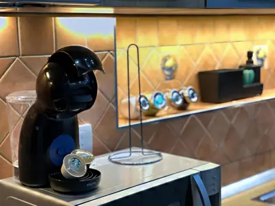 a counter with a coffee maker on a table at Allure of Belgrade (80m2-861ft2) in Belgrade