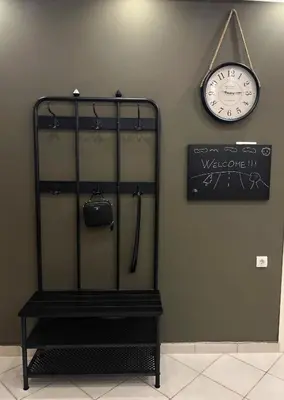 a clock hanging on a wall next to a shelf at Allure of Belgrade (80m2-861ft2) in Belgrade