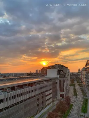 a view of the sunset from a building in a city at Allure of Belgrade (80m2-861ft2) in Belgrade