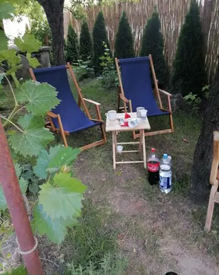 two chairs and a table in a yard at VisitorsCenter Ivanovo in Ivanovo