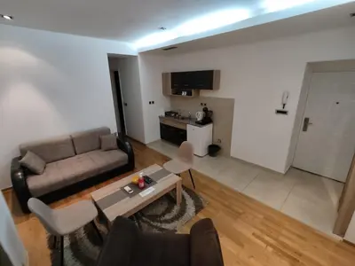 a living room with a couch and a table at Obilic 22 Apartment in Belgrade