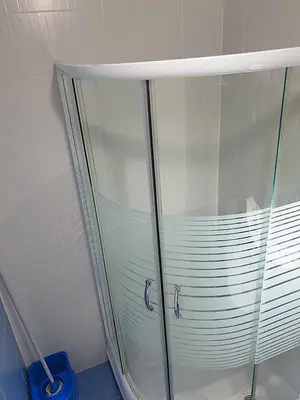 a shower with a glass enclosure in a bathroom at Belgradian 011 in Belgrade