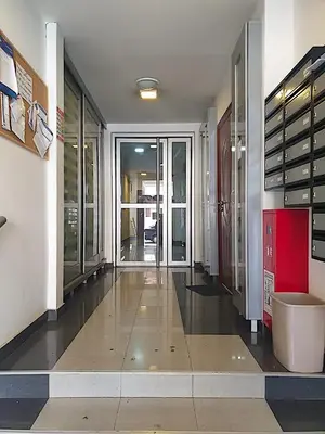 a large room with a hallway with glass doors at Belgradian 011 in Belgrade