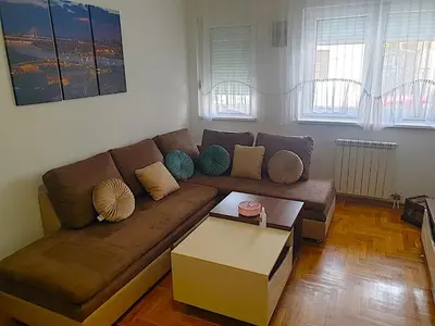 a living room with a couch and a coffee table at Belgradian 011 in Belgrade