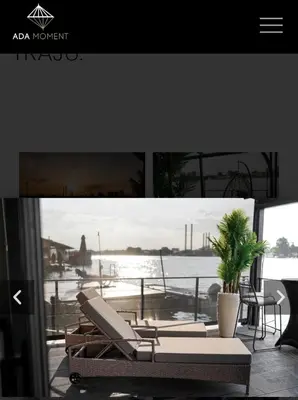 a picture of a living room with a view of the water at ADA MOMENT Splav- kuca na reci Beograd- Floating House on SAVA RIVER ,Belgrade in Belgrade
