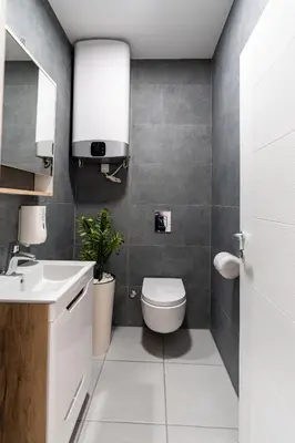 a bathroom with a toilet and a sink at ADA MOMENT Splav- kuca na reci Beograd- Floating House on SAVA RIVER ,Belgrade in Belgrade