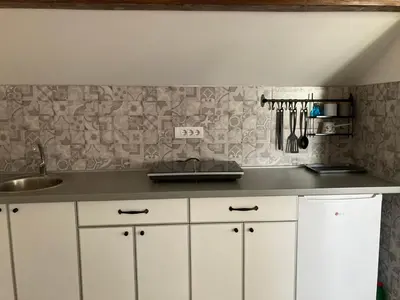 a kitchen with a sink and a counter top at Galerija Park 1 in Arandjelovac