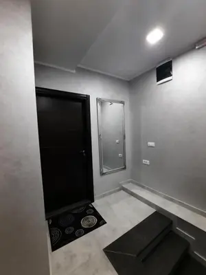 a bathroom with a walk in shower and a mirror at Galerija Park 1 in Arandjelovac