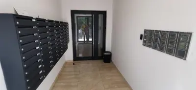 a hallway with a bunch of wine cellar doors at MOON LUX Apartman Beograd in Belgrade