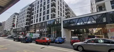 a city street with cars parked in front of buildings at MOON LUX Apartman Beograd in Belgrade