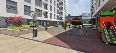 a playground in the middle of a city at MOON LUX Apartman Beograd in Belgrade