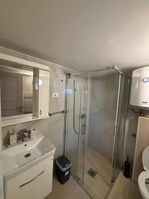 a bathroom with a shower and a sink at Vila POGLED in Arandjelovac
