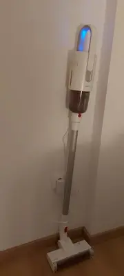 a toilet in a room with a light on the wall at Apartment Ana, Vračar, Belgrade in Belgrade
