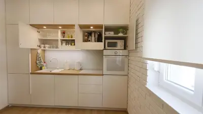 a kitchen with white cabinets and a microwave at Apartment Ana, Vračar, Belgrade in Belgrade