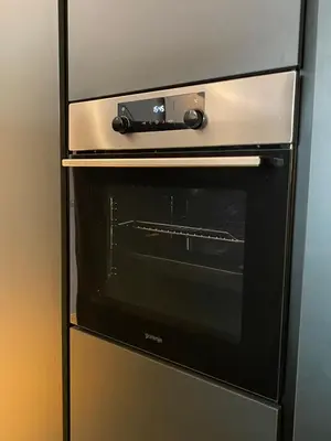 a oven in a refrigerator in a kitchen at DOM Boutique Apartments PARK VIEW in Belgrade
