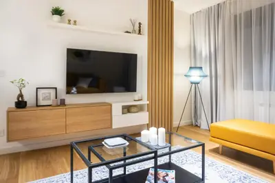 a living room with a tv and a couch at Akiton Apartment in Belgrade