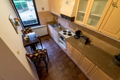 an overhead view of a kitchen with a stove at Wine house apartment in Karaburma