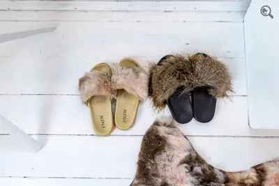 a group of three pairs of shoes with faux fur at Wine house apartment in Karaburma